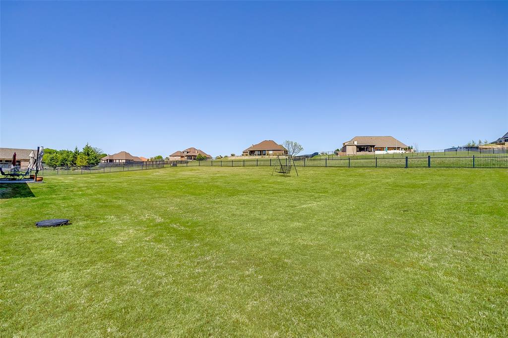 131 Condor View Weatherford, TX 76087 - Photo 29 of 34 a view of a golf course with a lake