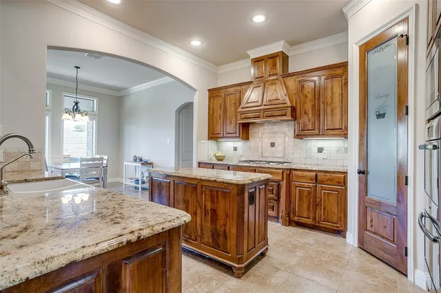 a bathroom with a granite countertop sink a mirror a vanity and shower