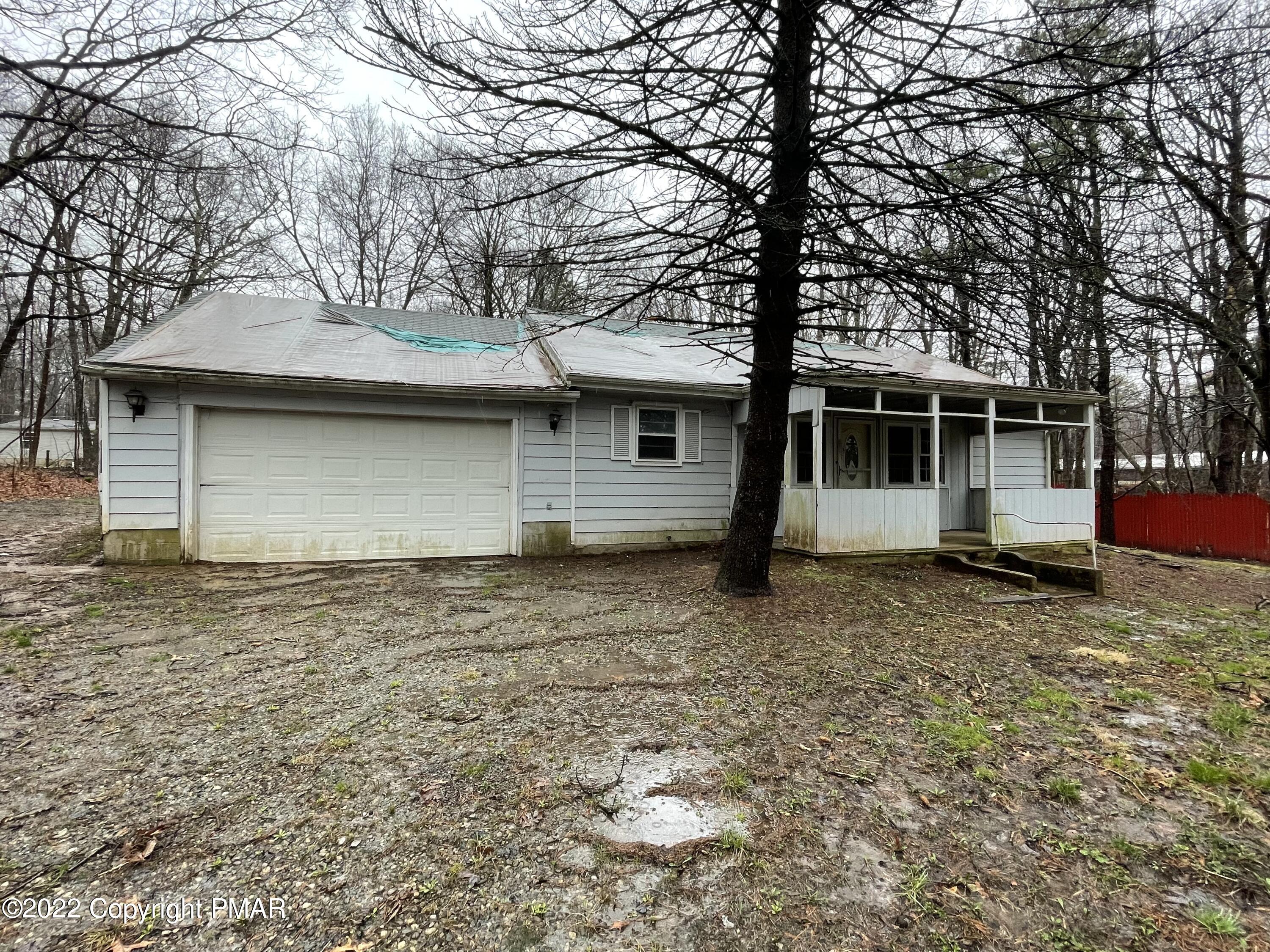 1907 Johns Road Effort, PA 18330 - Photo 1 of 5 a front view of a house with a yard