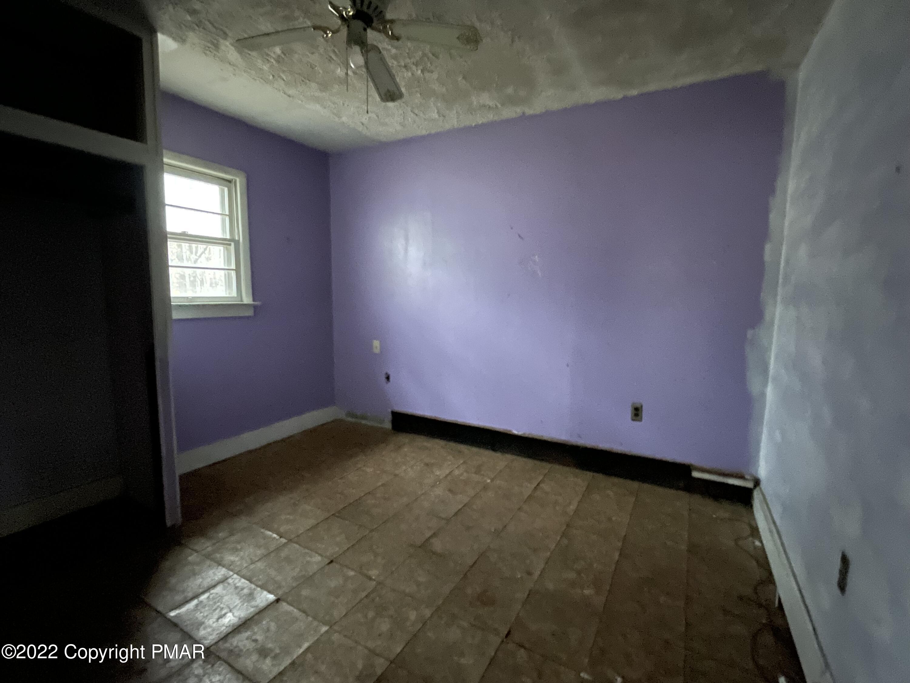 1907 Johns Road Effort, PA 18330 - Photo 5 of 5 a view of a room with a ceiling fan and window