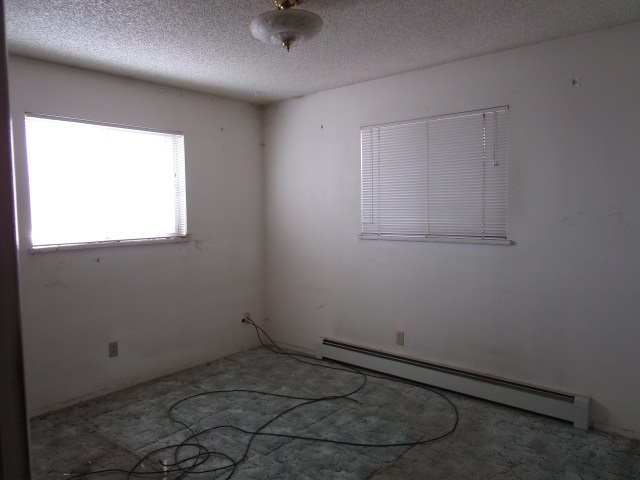 1054-19 19 1/2 Road Fruita, CO 81521 - Photo 11 of 24 an empty room with a empty space and windows