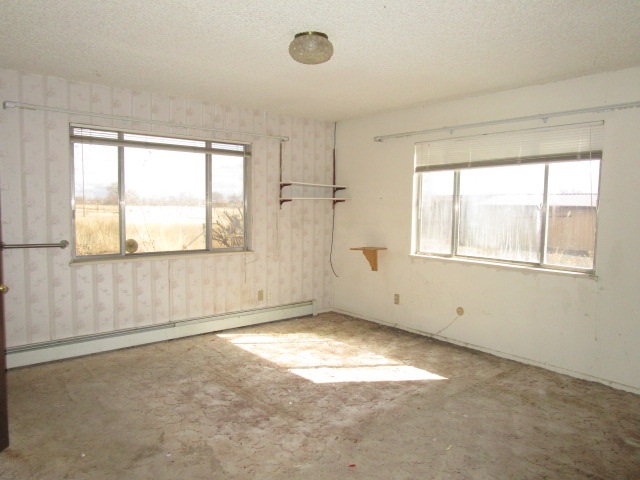 1054-19 19 1/2 Road Fruita, CO 81521 - Photo 12 of 24 an empty room with a empty space and windows