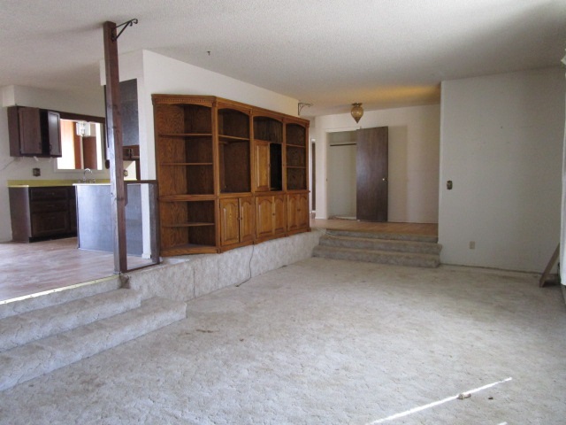 1054-19 19 1/2 Road Fruita, CO 81521 - Photo 6 of 24 an empty room with a empty space and windows