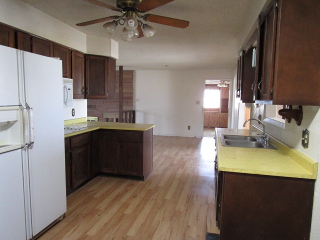 1054-19 19 1/2 Road Fruita, CO 81521 - Photo 8 of 24 a kitchen with a sink appliances and cabinets