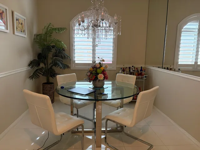 a view of a dining room with furniture and window