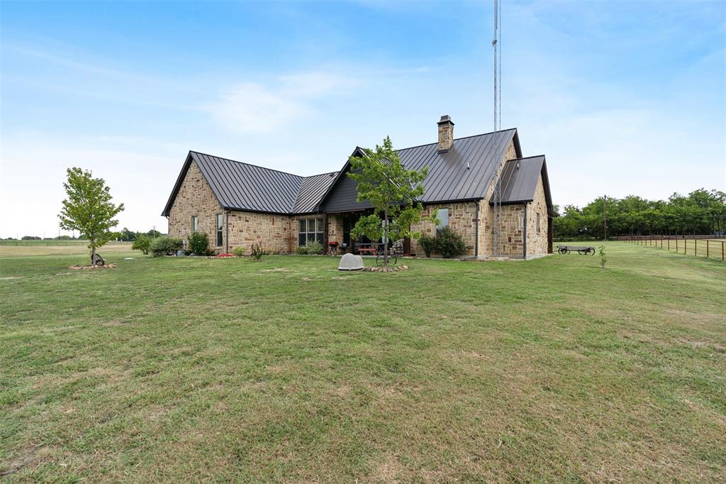 4180 North Smith Road Fate, TX 75087 - Photo 25 of 27 a front view of a house with garden