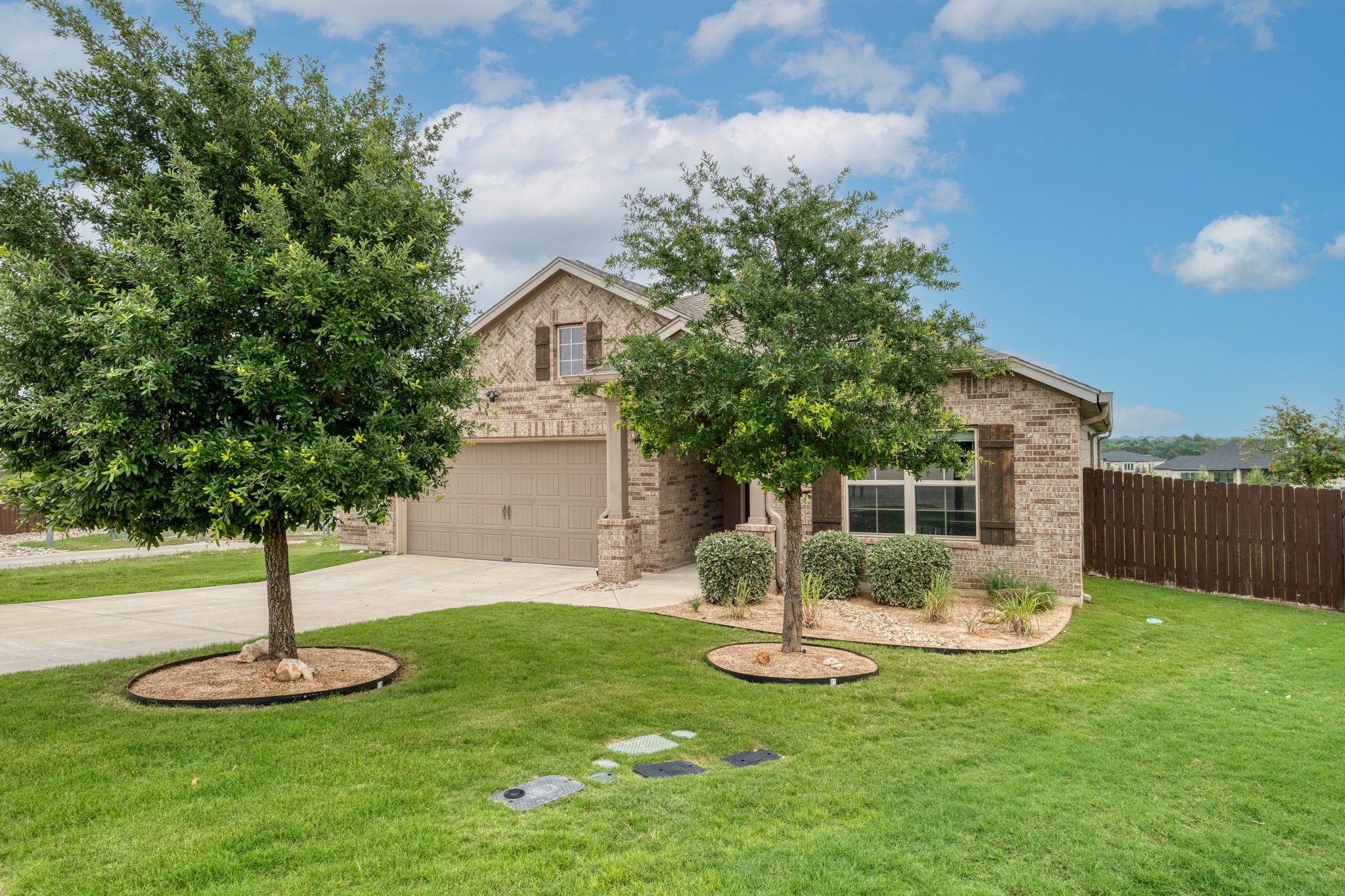 1000 Bright Star Cove Georgetown, TX 78628 - Photo 1 of 40 a front view of a house with garden and tree