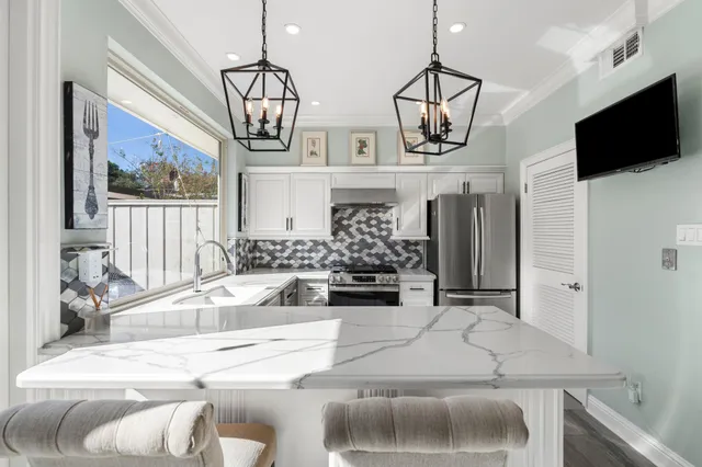 a view of living room with furniture and flat screen tv