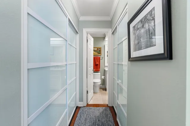 a view of gallery with wooden floor