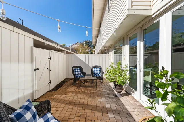 a view of a porch with seating space