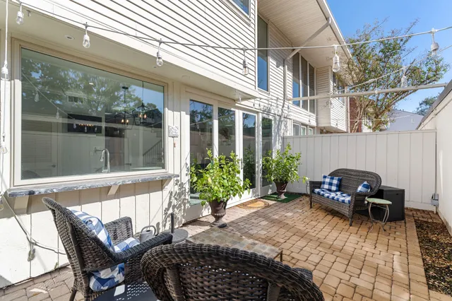 a view of a chair and tables in the patio