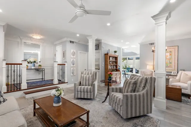a living room with furniture and a table