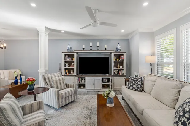 a living room with furniture and a flat screen tv