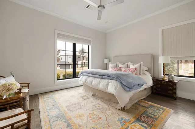 a bedroom with a large bed and a window