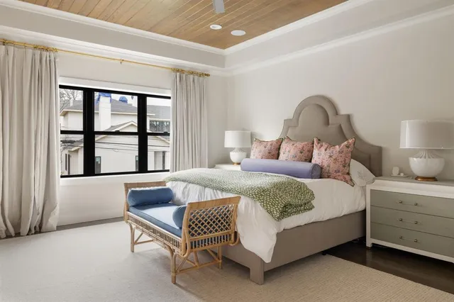 a bedroom with a bed chair and window