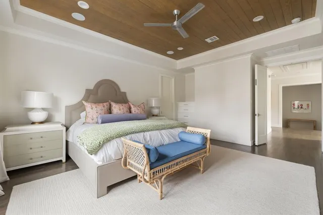 a bedroom with a bed and a lamp