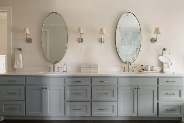 a bathroom with sink and mirror