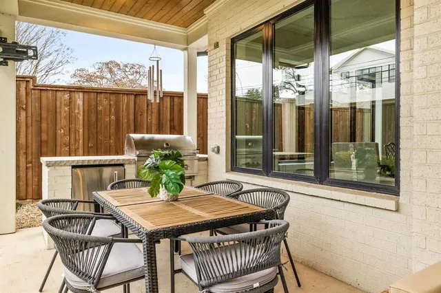 a dining room with furniture window and outdoor view