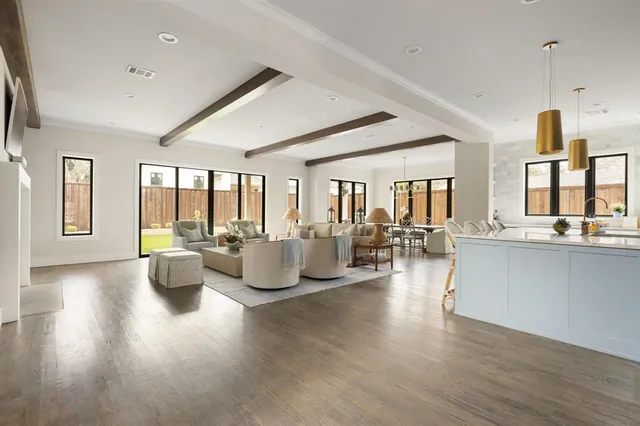 a living room with fireplace furniture and a wooden floor