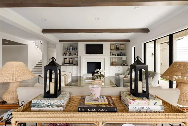 a living room with fireplace furniture and a flat screen tv