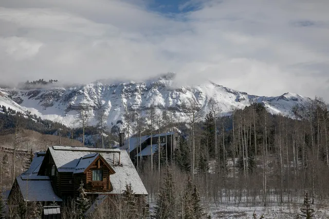 a view of a house with a mountain