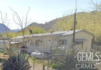 a view of a back yard of the house