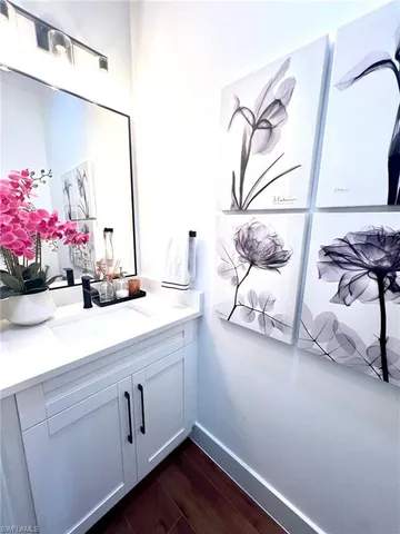 a white toilet sitting next to a bathroom sink