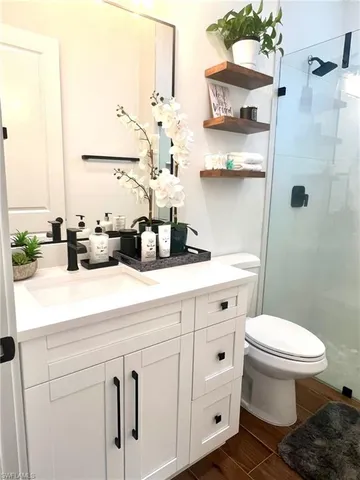 a utility room with sink dryer and washer