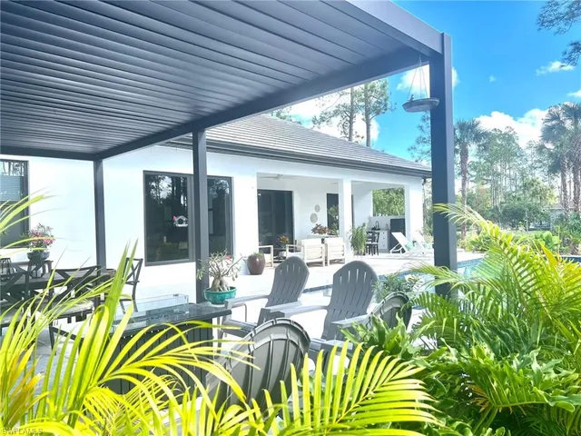 a outdoor dining space with furniture