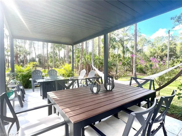 a view of a yard with a large tree
