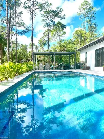 a view of a house with swimming pool