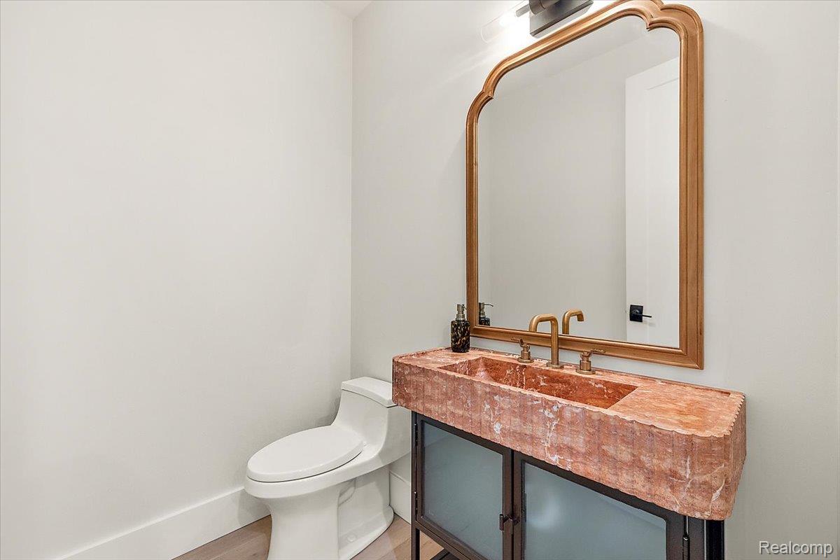 13459 Haddon Street Fenton, MI 48430 - Photo 19 of 84 Half bathroom with vanity and light wood finished floors