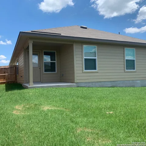 a view of front of a house with a small yard