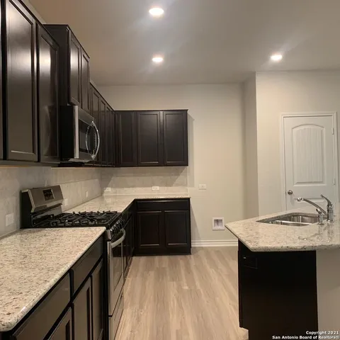 a kitchen with a sink and cabinets