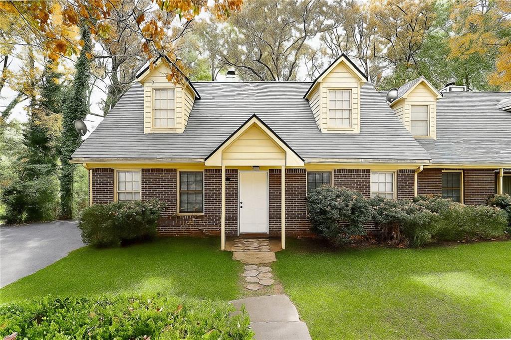 a view of a house with garden and plants