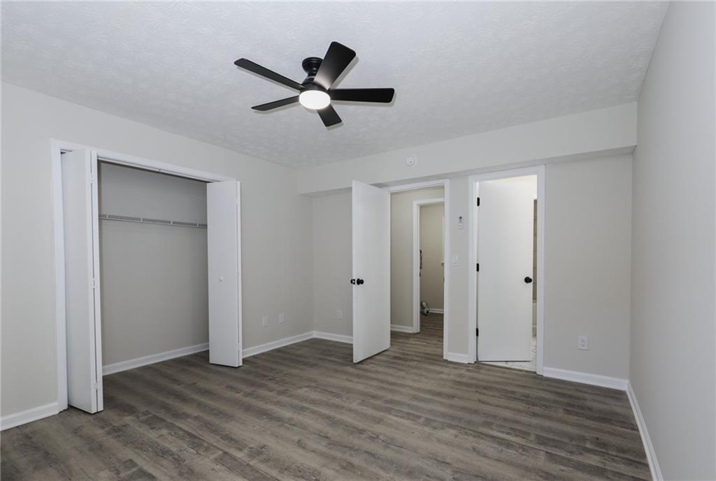 5343 Ridgemere Court Stone Mountain, GA 30083 - Photo 9 of 20 a view of a livingroom with wooden floor and white walls