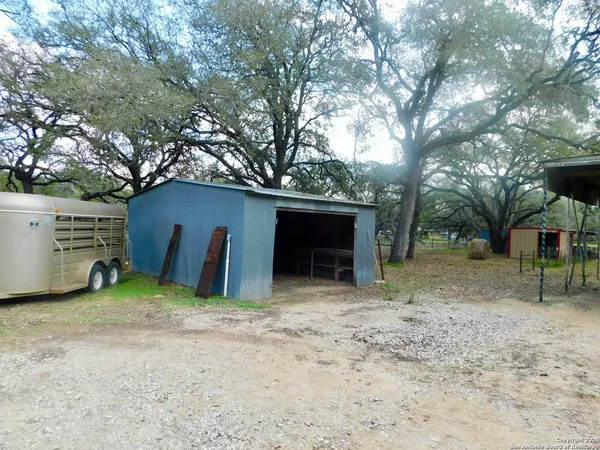 a view of a house with a yard and garage