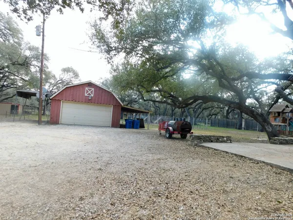 a view of a house with a yard and garage
