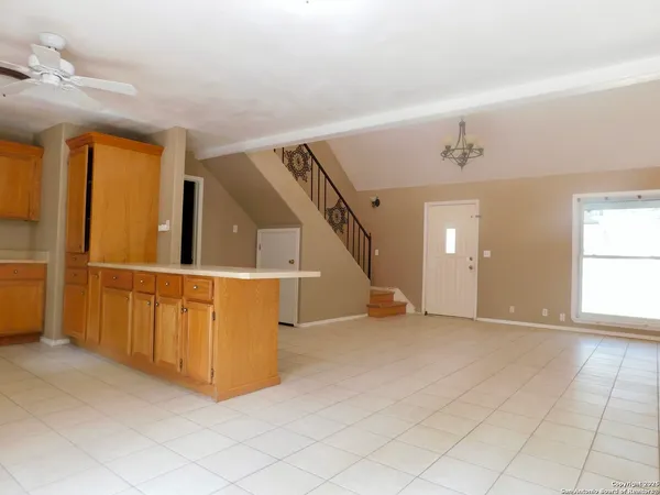 a view of an empty room with stairs