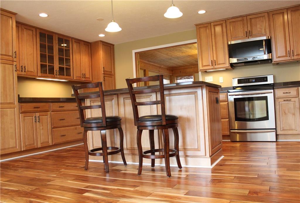 558 Partridge Run Road Gibsonia, PA 15044 - Photo 2 of 24 Gorgeous custom designed kitchen with KitchenCraft Cabinetry and Zodiaq Quartz Saddle Brown countertops.