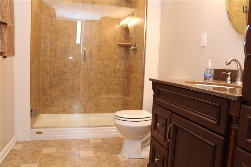 558 Partridge Run Road Gibsonia, PA 15044 - Photo 17 of 24 2nd full bath in lower level has a dazzling walk-in shower. The ceramic tile flooring will be toasty warm from the radiant floor heating!