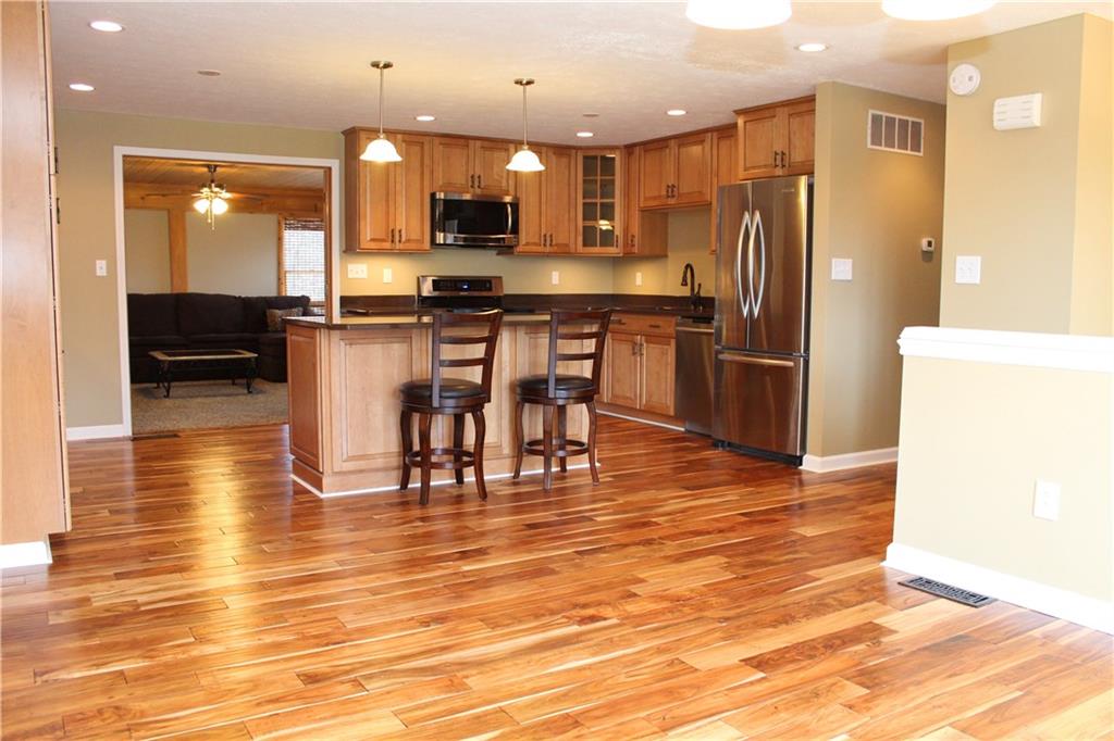 558 Partridge Run Road Gibsonia, PA 15044 - Photo 3 of 24 View from the dining area through the kitchen into the family room.