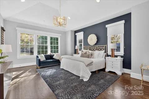 a bed room with a bed mirror and a window