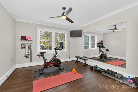 a room with gym equipment and a window
