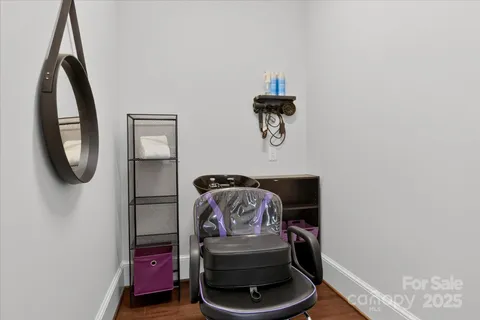 a bathroom with a toilet and a mirror