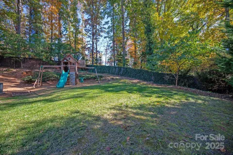 a view of a backyard with a slide