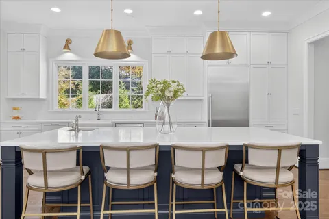 a kitchen with a table and chairs in it