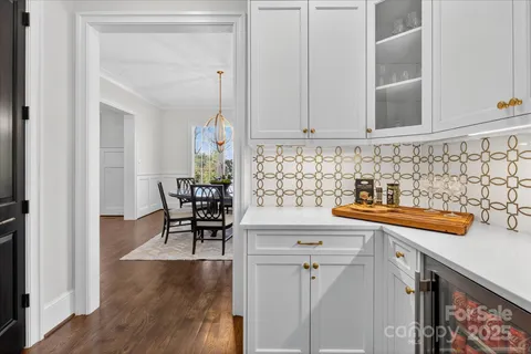 a kitchen with stainless steel appliances granite countertop a sink and cabinets
