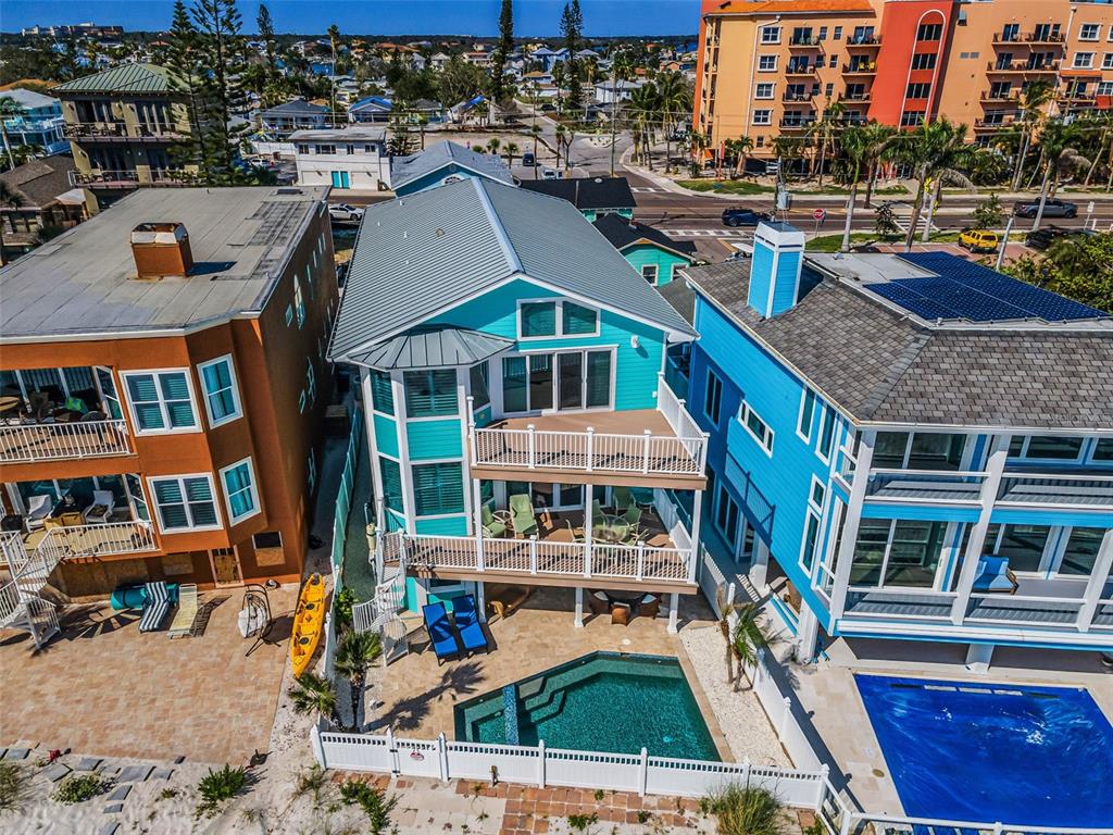 13303 Gulf Lane Madeira Beach, FL 33708 - Photo 1 of 42 a aerial view of a house with a yard
