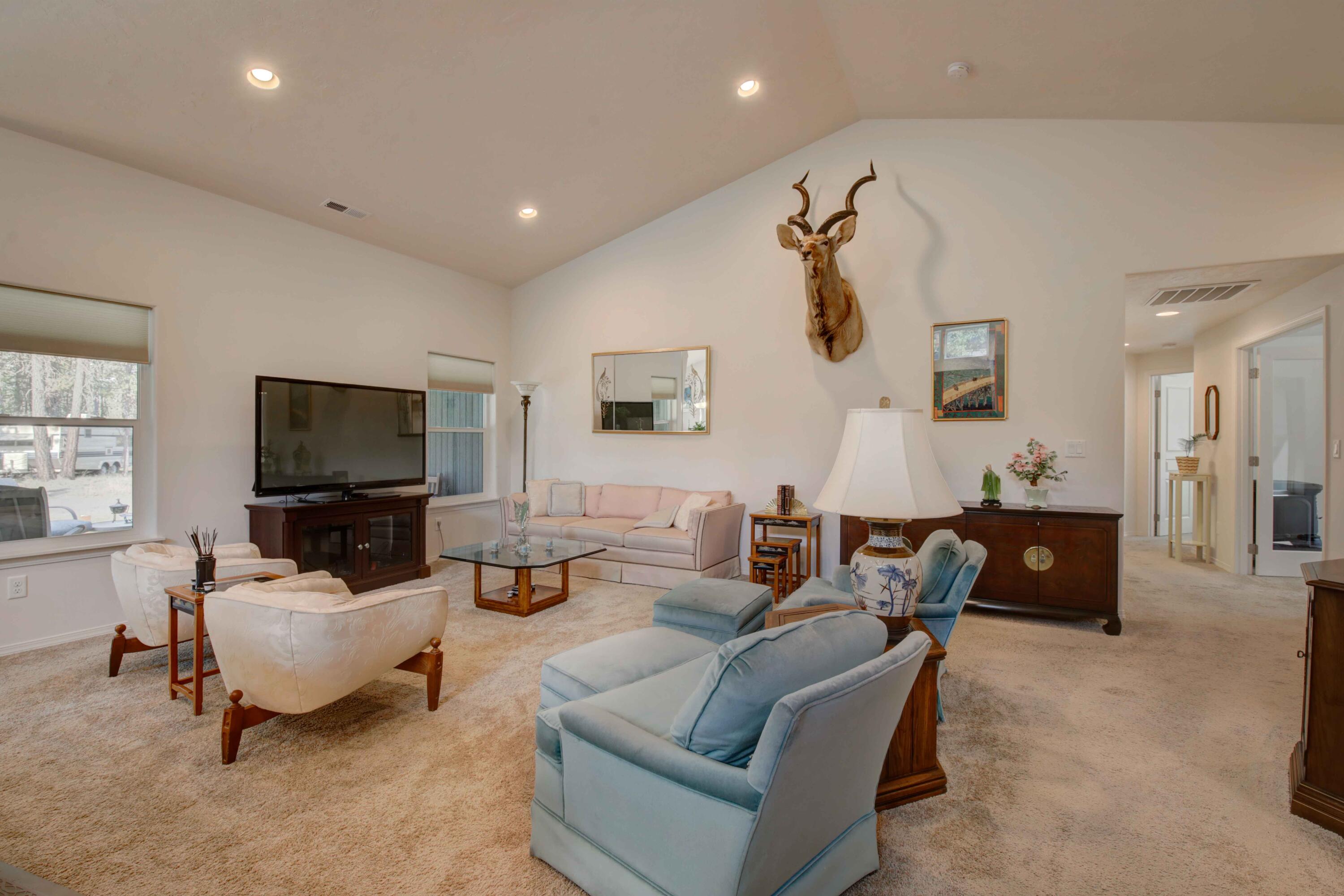 17160 Elsinore Road Bend, OR 97707 - Photo 11 of 47 a living room with furniture and a flat screen tv